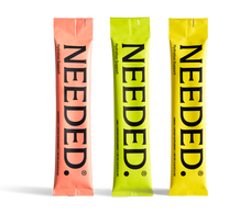Three Needed Hydration Support stick packs in grapefruit, lime and lemon